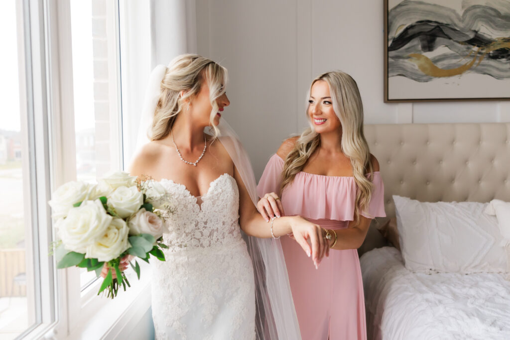 sisters getting ready for cambridge mill wedding