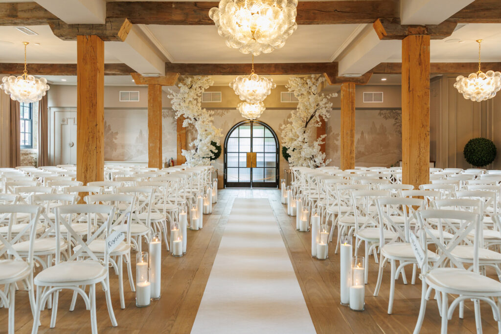 Elegant Elora Mill wedding ceremony décor captured by Cambridge photographer.