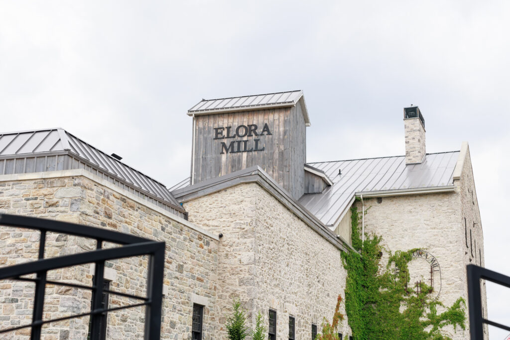 Elora Mill wedding exterior with ivy walls in Ontario.