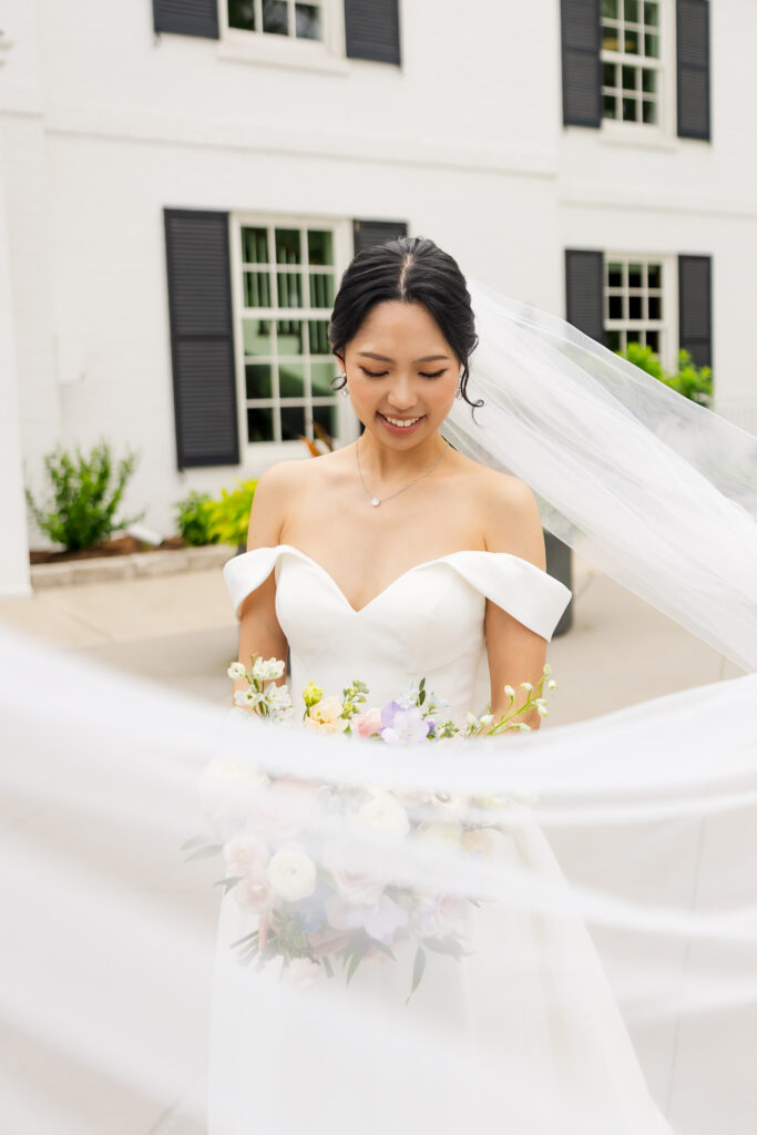 Editorial portrait of bride on the estate grounds, captured by Ontario wedding photographer.