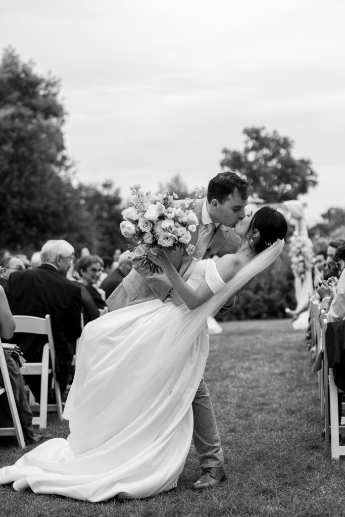 Candid portrait of newlyweds on the estate grounds, captured by Ontario wedding photographer.