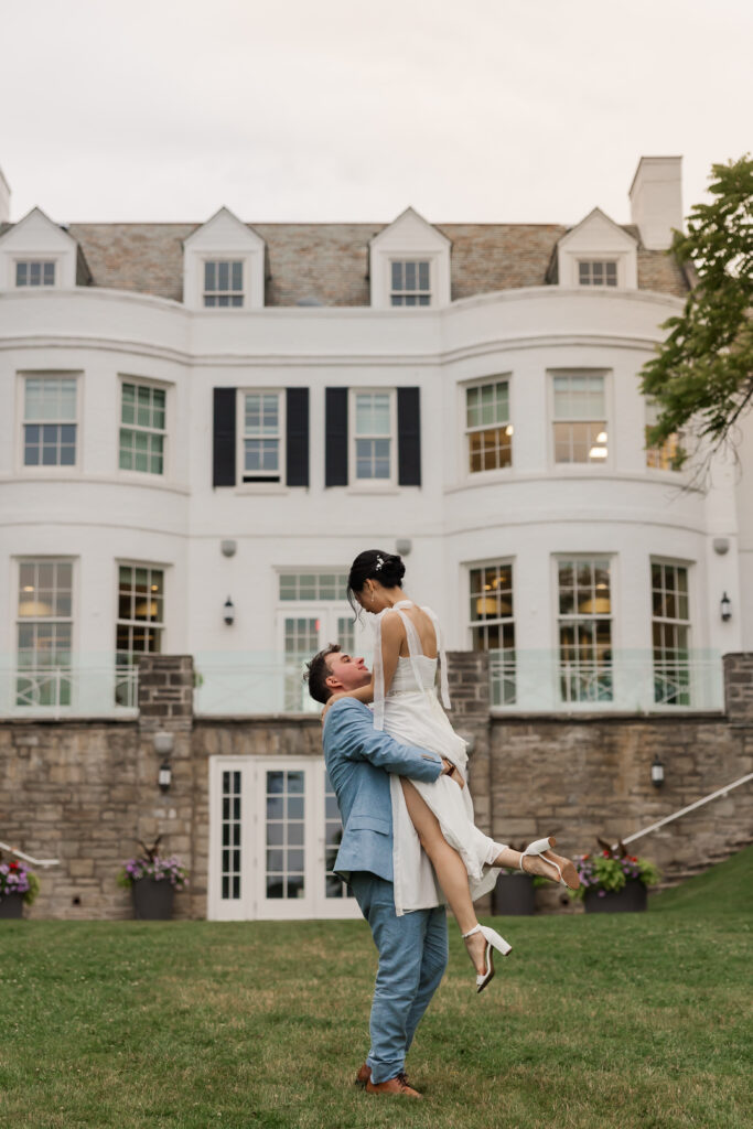 Bride and groom back of Harding Waterfront Estate, Mississauga wedding venue.