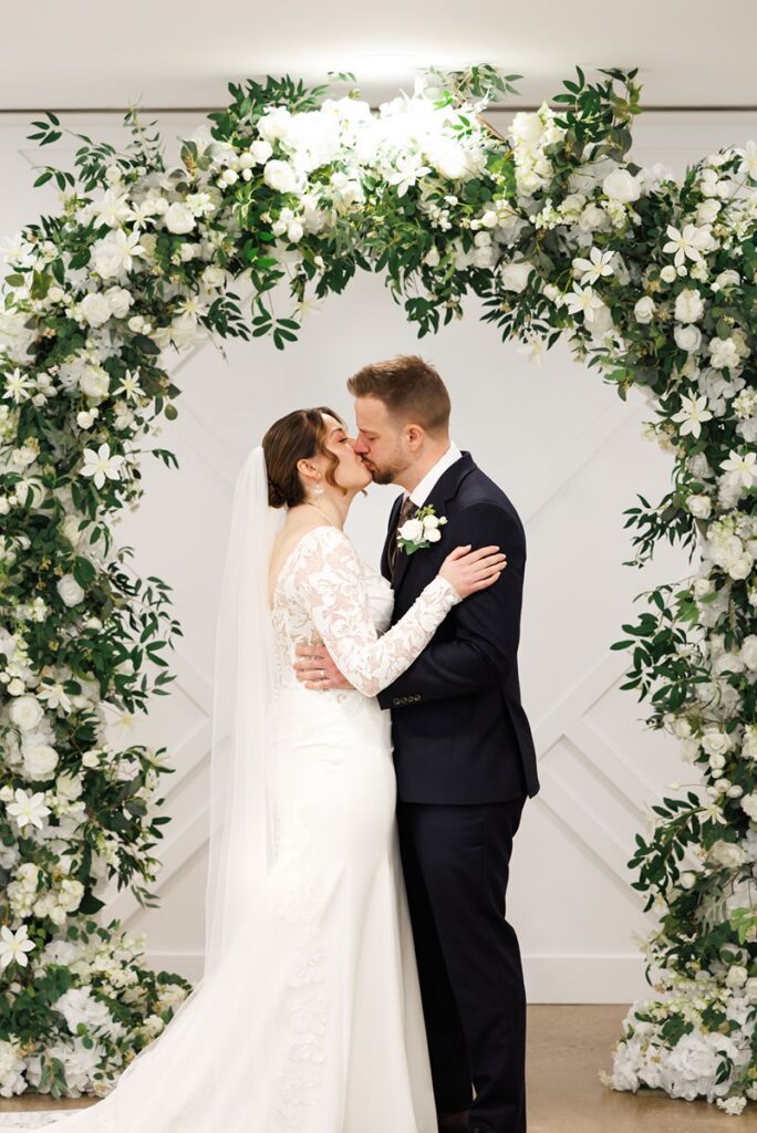 couples first kiss at dtk chapel wedding