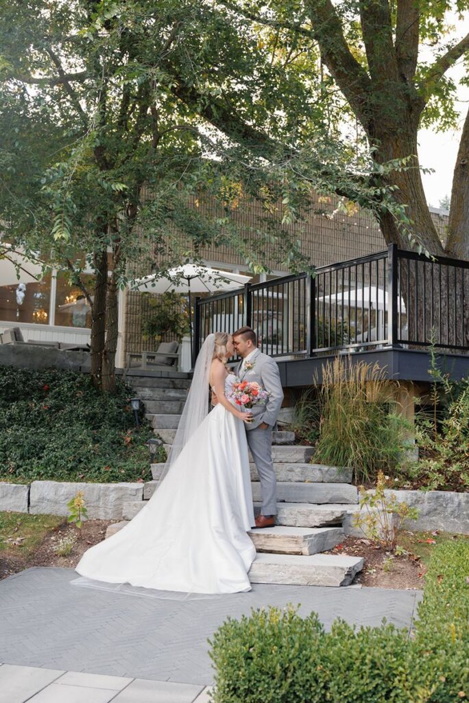 wedding couple on stairs at elle by stella in kitchener