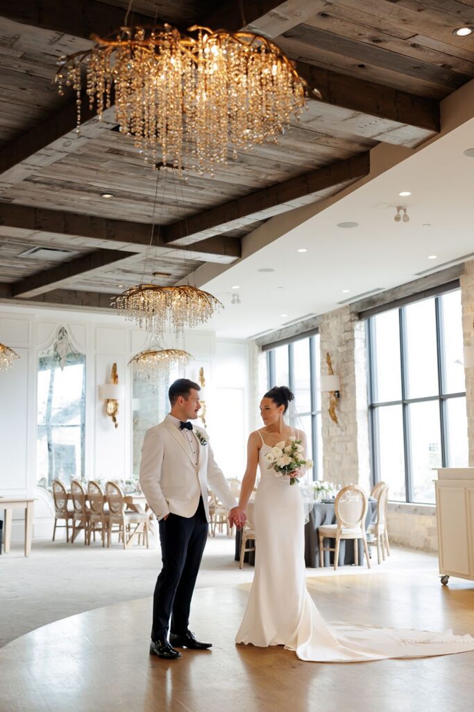 couple inside the grand reception room at elora mill