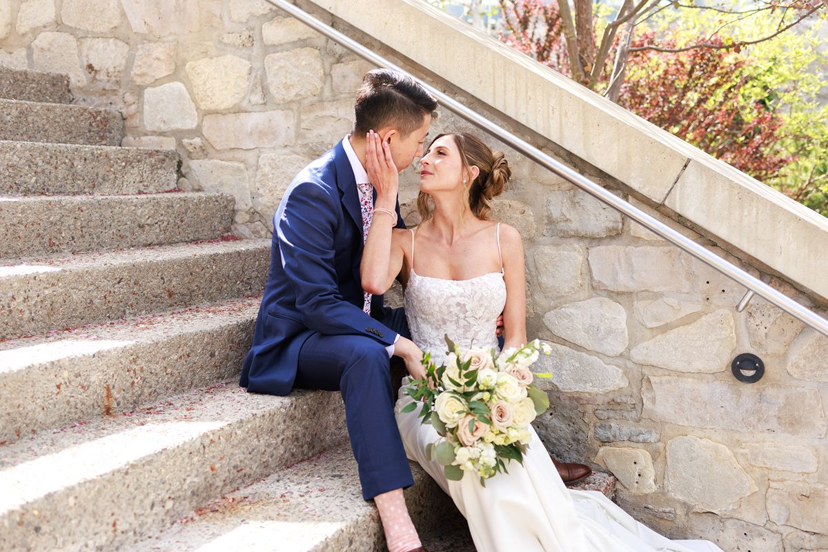 cambridge mill wedding venue guide with couple sitting on the mill steps