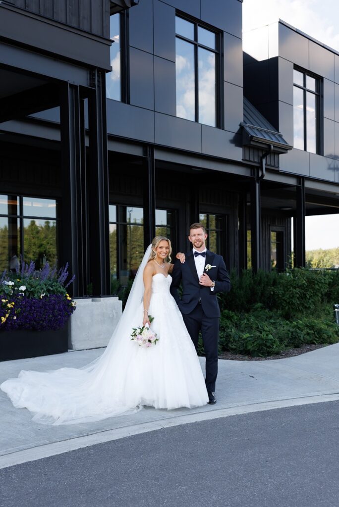 bride and groom outside of the tpc osprey valley wedding venue in caledon ontario 